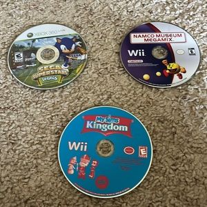 Three Video games- 2 wii and one xbox 360 games